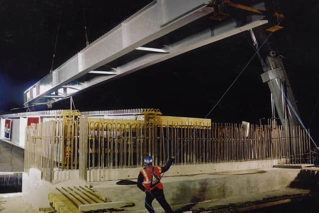 vital connection: Installing the bridge across the railway line in 2001 to open up the southern half of the site