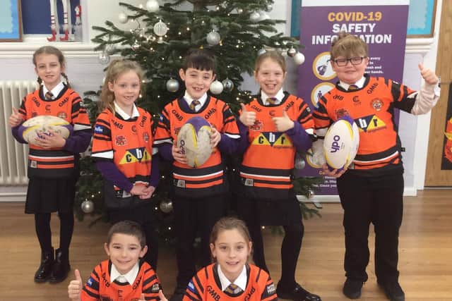 Pupils from Castleford Park Junior Academy in their Tigers shirts.