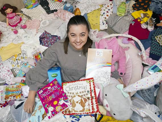 Jess Tighe pictured above with all the donated items she collected for Pinderfields children's ward in the lead up to Christmas