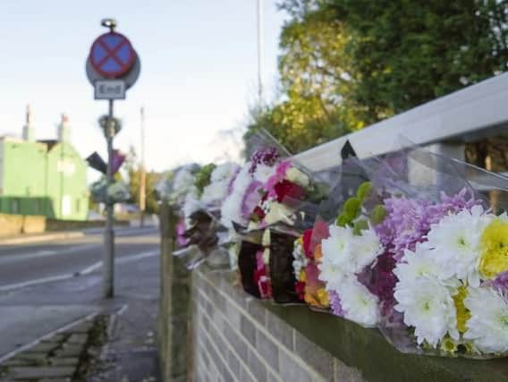 Flowers have been left at the scene on Standbridge Lane.