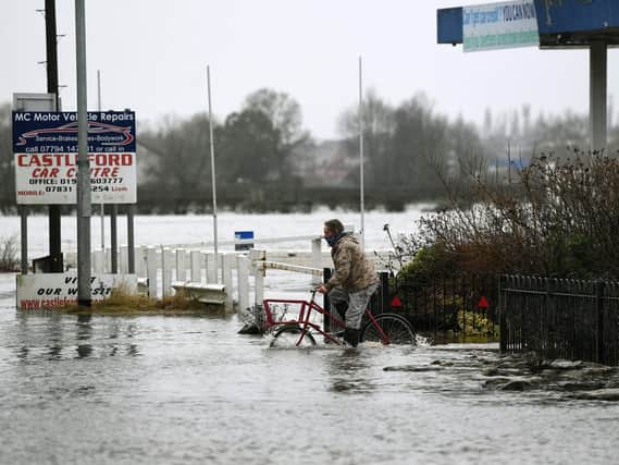 Flooding has been reported across the Wakefield district this morning, as rivers are flooded with days of rain from Storm Christoph. Pictured is a cyclist on Barnsdale Road, Castleford.