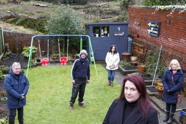 Residents Melanie Jones, David Kay, and Karen Hillary alongside Pontefract South councillors David Jones and Celia Loughran against the backdrop of the wood.