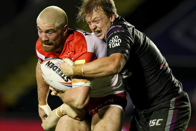 ACTION SHOT: Eddie Battye battles with Kyle Amor of St Helens. Picture: Paul Currie/SWpix.com.
