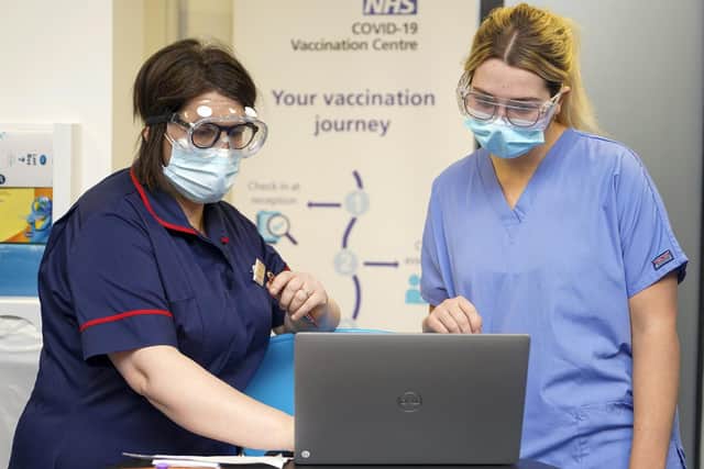 The number of cases of Covid-19 in the Wakefield district has topped 20,000 for the first time. Pictured are staff at a vaccination centre at Spectrum Community Healthcare, Wakefield.