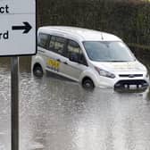 An urgent review of flood defences and drainage in the Five Towns is needed, an MP has said, after properties were flooded during a weekend of heavy rain. Pictured is a car braving a flooded Barnsdale Road in Castleford.