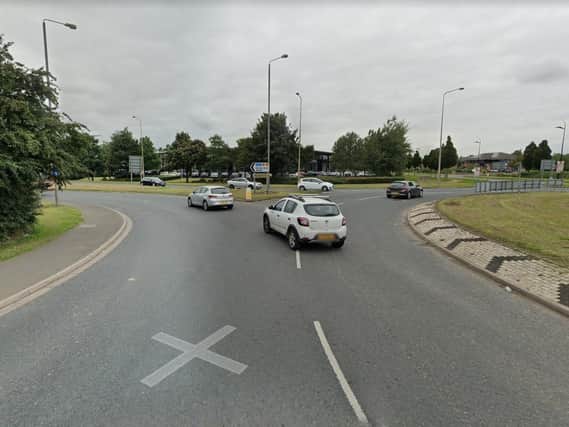 A man has been taken to hospital after his car collided with a traffic light on a major Wakefield road.