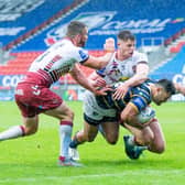 Leeds Rhinos and Wigan Warriors in action last season. Their Round Three game will be televised live by Sky Sports. (ALLAN MCKENZIE/SWPIX)