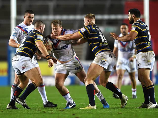Eddie Battye, pictured on the attack against Leeds Rhinos, has a calf strain and is unlikely to feature this weekend. Picture by Jonathan Gawthorpe.