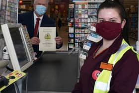 Coun Charlie Keith, Mayor of Wakefield, presents a certificate to staff at Sainsbury's in Trinity Walk to celebrate their hard work during the pandemic. Photo: Sainsbury's Trinity Walk