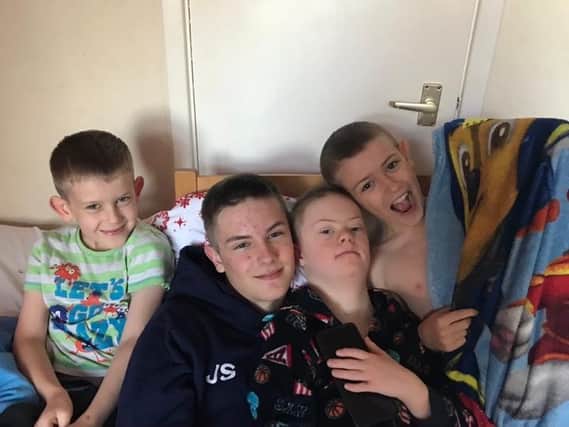 A Wakefield mum says clinically vulnerable children must notbe forgotten after a months-long fight to secure a Covid vaccine for her son. Isaac Sheard is pictured with his brothers. Photo: Ann-Marie Sheard