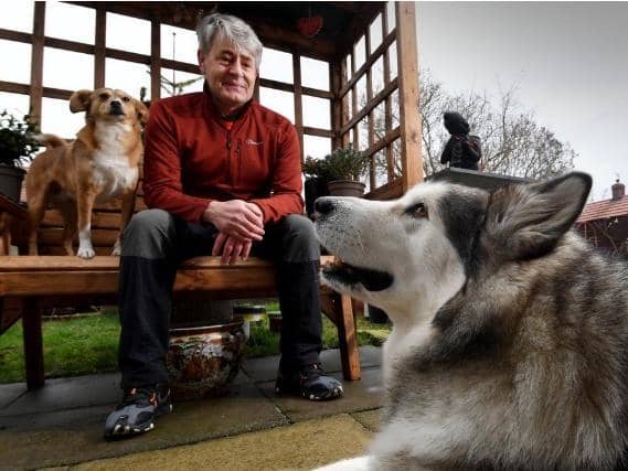 Vic Ferguson pictured with his dogs Mishka and Amber. Picture by Simon Hulme