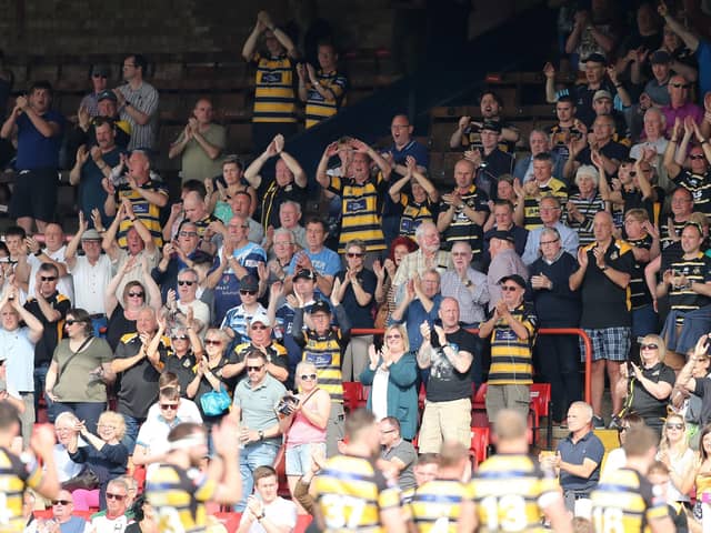 Fans of York City Knights applaud their team.