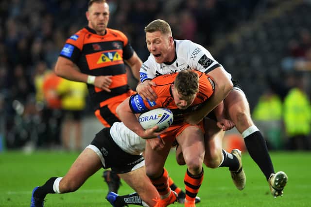MOVING ON: Chris Green takes down Castleford's Adam Milner while playing for Hull FC last season. Picture: Bruce Rollinson