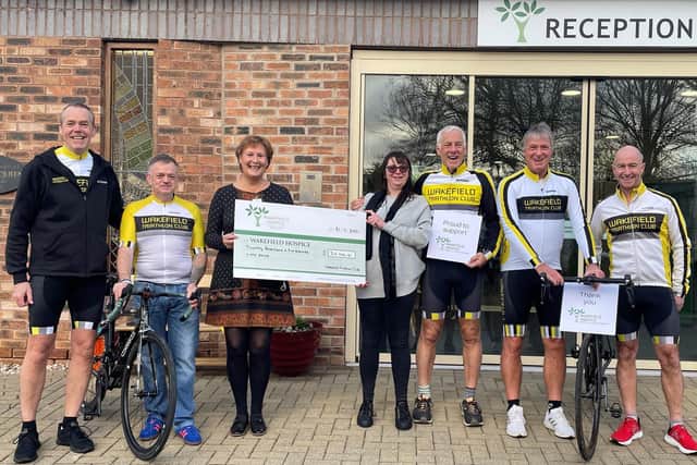 Presentation of the £20,000 raised by Wakefield Triathlon Club members for Wakefield Hospice.