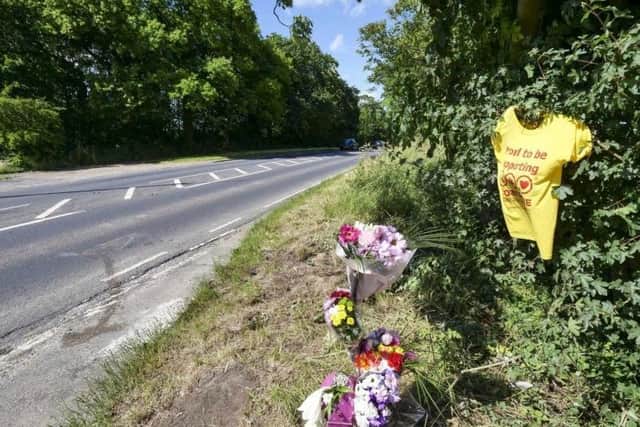 Flowers left at the scene where Mr and Mrs Gossedge died.
