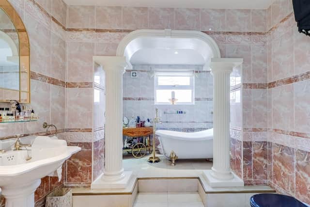 Bathe or shower in style and luxury, within this elegant tiled bathroom.