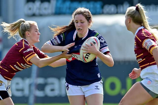 Trinity's Aimee-Leigh Wood, centre of picture, in Women's Super League action against Huddersfield Giants. Picture by Wakefield Trinity.
