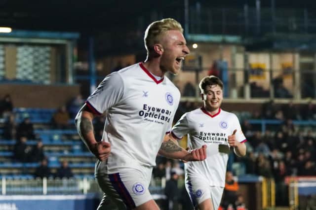 Jake Morrison celebrates scoring a goal for Wakefield AFC against Wombwell Main, with teammate Red Bates in the background. Picture: mm10_sports_photo