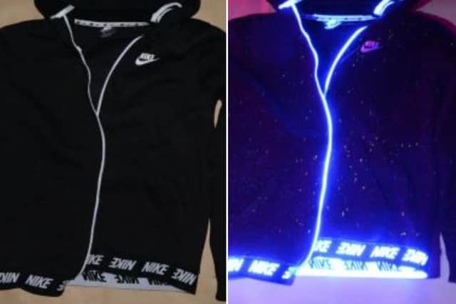 SmartWater flecks can be seen on the jacket on the right, under the UV light.