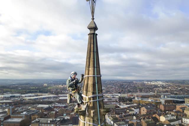 Dan Bottomley from SSHConservation's rope access team can be seen working on the 500-year-old spire at Wakefield Cathedral.