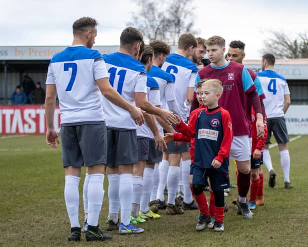 The introductions before Emley's game with Sherwood Colliery as the ball boys shake hands with the visiting players. Picture: Mark Parsons