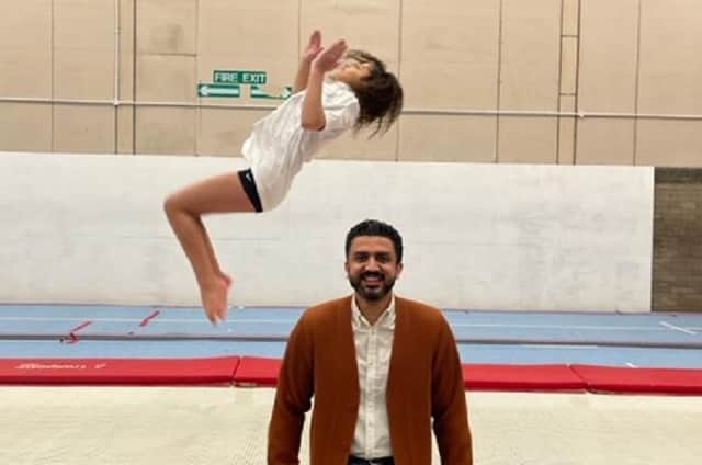 Wakefield Gym Club’s Scarlett Parchment, who has been chosen for the England Junior Squad, pictured with Adeem Younis, of the Penny Appeal, who have been helping the club to maintain their run of success.