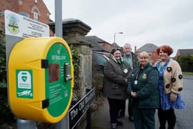 Life savers....Julia Talbot, Keith Morris, Teresa Allot, Joanne Watson with one of the many defibrillators in Sitlington.
