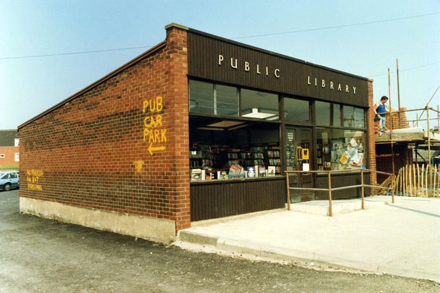 Halton Branch Library on Selby Road in April 1987. On the right, construction work is in progress on the new shopping centre development which would include a new library to replace the old one.