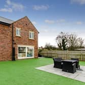 The Ackworth property with garden and seating area to the fore.