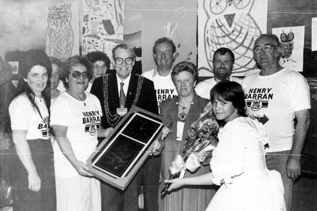 The Henry Barran Centre in Gipton was celebrating its Golden anniversary in Jukly 1988. The Lord Mayor, Coun Arthur Vollans is pictured presenting his gift of an ornamental wall-clock to the Centre's management committee. Local people were invited to enjoy a buffet meal at 1938 prices, and take part in fun activities and competitions.