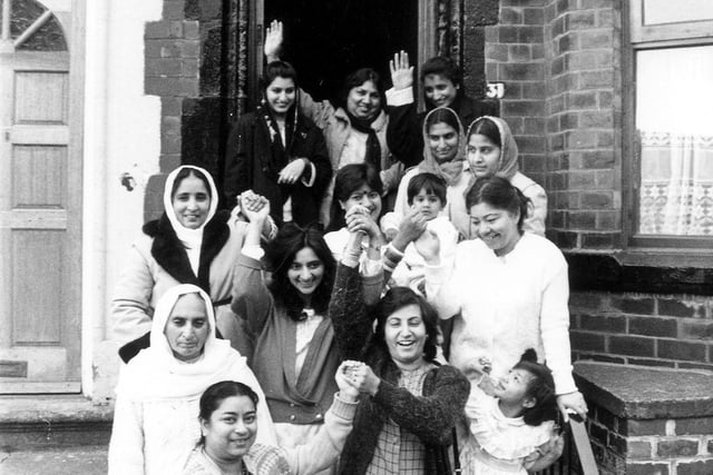 A group of women and children celebrating the opening of the Milun Womens' Centre on Hilton Road in Harehills in December 1988. 'Milun' means 'togetherness' in three languages, Punjabi, Urdu and Bengali. The centre was run by four part-time workers and opened from 10am to 4pm each day.
