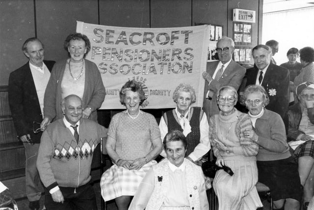 Members of Seacroft Pensioners Association at Seacroft Library where they had gathered for their weekly meeting in March 1988. On this occasion they had invited Denis Healey MP to dedicate a new banner to be used as part of their campaign for increased pension.