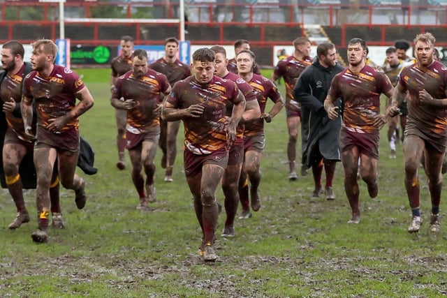 Mud splattered Batley and York players at half-time. Picture: Neville Wright