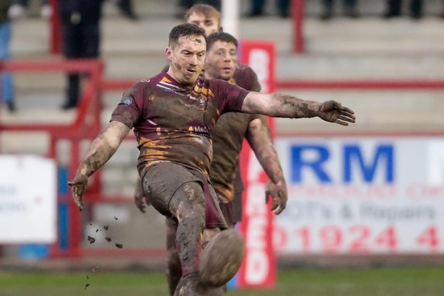 Tom Gilmore kicks downfield for Batley Bulldogs against York City Knights. Picture: Neville Wright