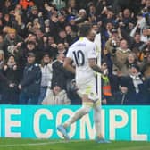 Leeds United fans celebrate Raphinha scoring Leeds United's second goal against Manchester United.