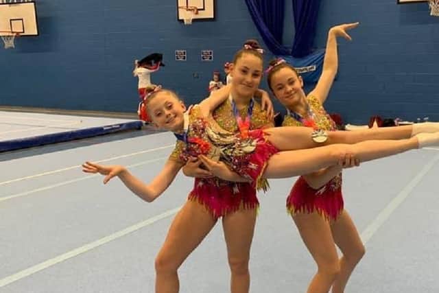 Wakefield Gym Club's Bethany Butterfield, Lucy Vause and Georgia Robinson show the kind of style that helped them to a silver medal at the British Championships.