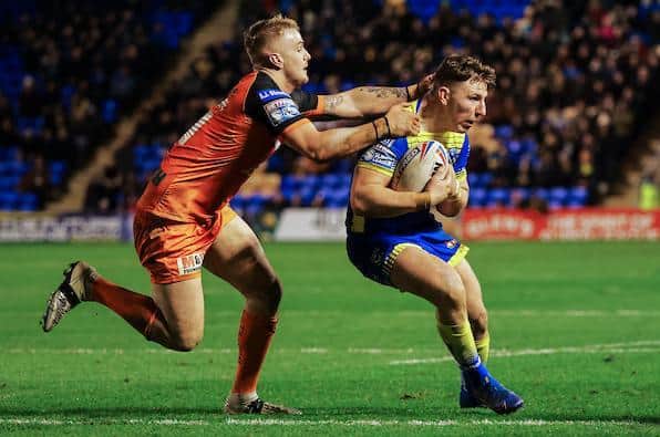 Alex Sutcliffe, pictured tackling Warrington's George Williams, has had a tough week. Picture by Alex Whitehead/SWpix.com