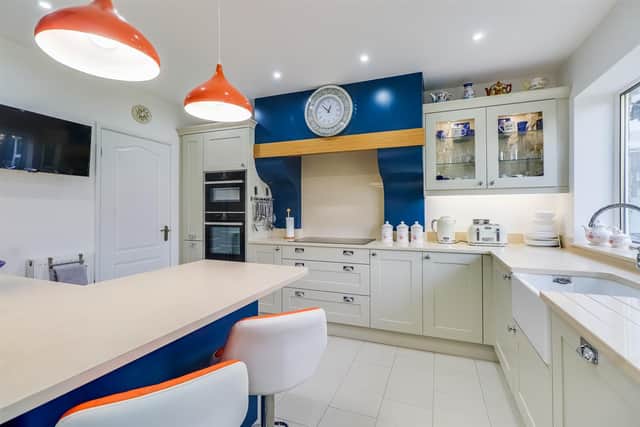 The light and bright kitchen is well equipped, with fitted units and a breakfast bar.