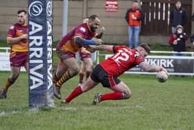 Ash Haynes about to go over for a try for Normanton Knights against Wigan St Judes in their first game of the new season in the National Conference League. Picture: Scott Merrylees