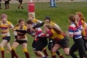 Jenny Sutcliffe about to break through for her try for Castleford RUFC Girls' U13s.