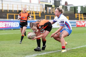 Kayleigh Goddard gathers the ball for Castleford Tigers against Wakefield Trinity Ladies. Picture: Simon Hall