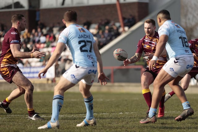 Ben White passes to Batley Bulldogs teammate Dane Manning. Picture: Neville Wright