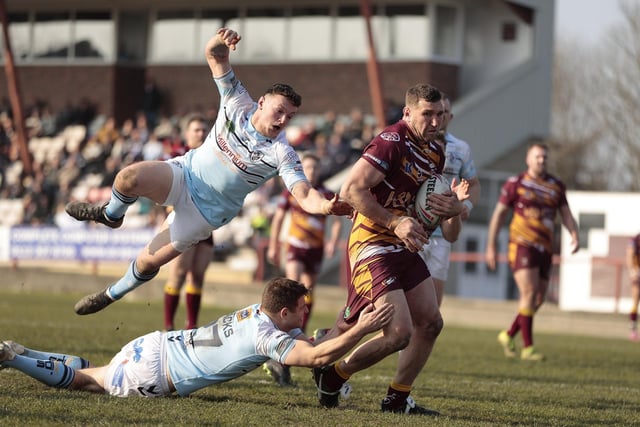Batley's former Featherstone player Dane Manning tries to get clear of Rovers tacklers. Picture: Neville Wright