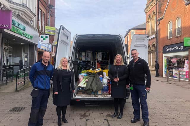 Yorkshire Building Society colleagues Jason Suddick, Clare Schofield, Joanne Wincer and Ken Haycock with items donated for Ukrainian refugees