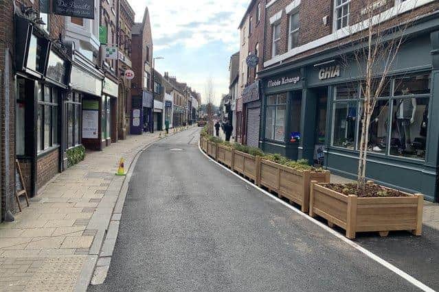 Traffic can still access Ropergate but plant boxes now line the street to restrict parking and allow tables to be put outside.
