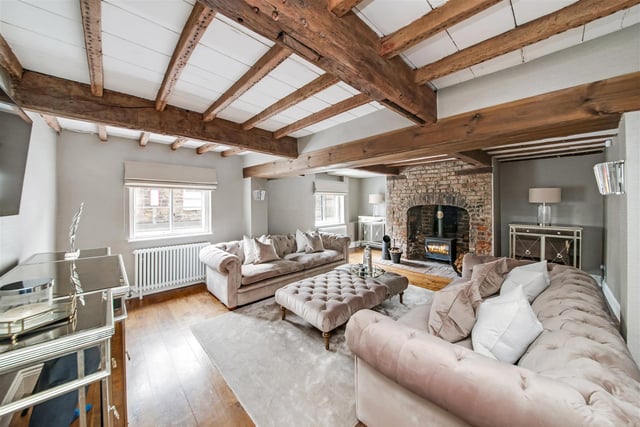 Brimming with charm and character with exposed timber beams and batons to the ceilings. The focal point of the room is the fabulous inglenook brick fireplace with multi-fuel stove set upon a raised brick hearth.