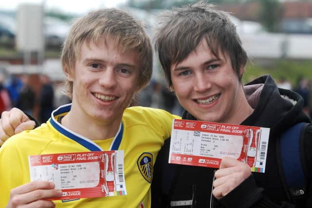 Leeds United fans queue for play off final tickets. Jack Dearnley (left) aged 17 from Ossett and Sam Aveyard aged 17 from Horbury with their tickets.