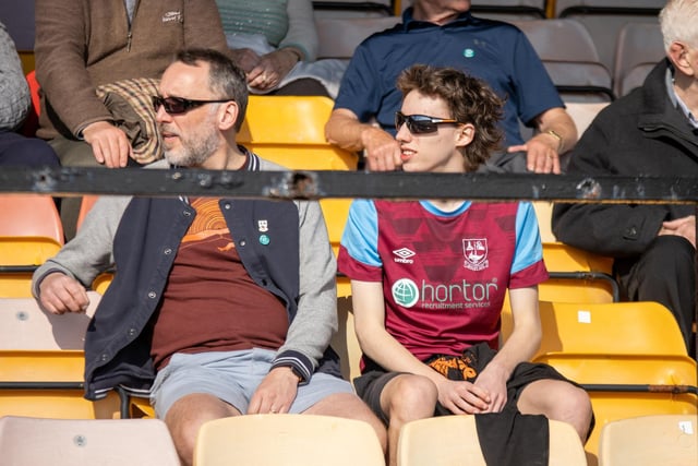 Emnley supporters enjoy the sunshine while watching their team take on Silsden. Picture: Mark Parsons