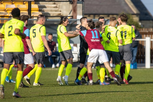 Kane Swinburn appears to be peacemaker as tempers fray between Emley and Silsden players. Picture: Mark Parsons