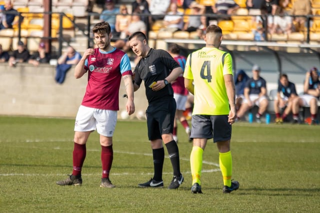 The referee checks Alex Metcalfe's number before producing a yellow card. Picture: Mark Parsons